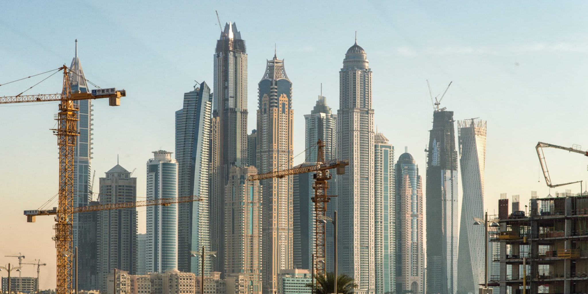 Dubai Construction New construction work in Dubai. Marina Dubai district in the background.